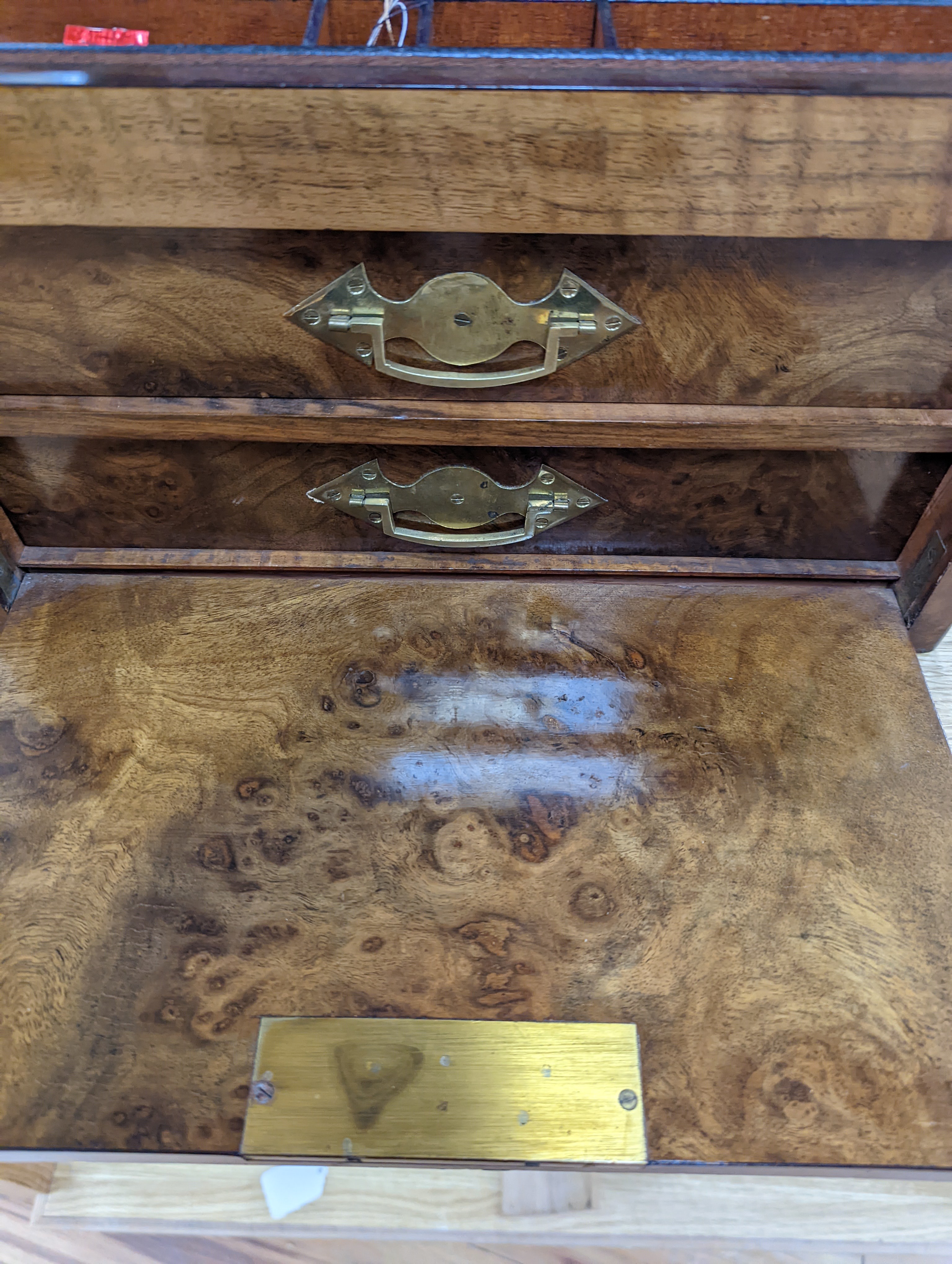 A Victorian walnut sewing casket, 34cm, containing sewing related accessories
